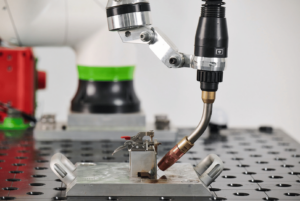 Up close of weld torch and fixture